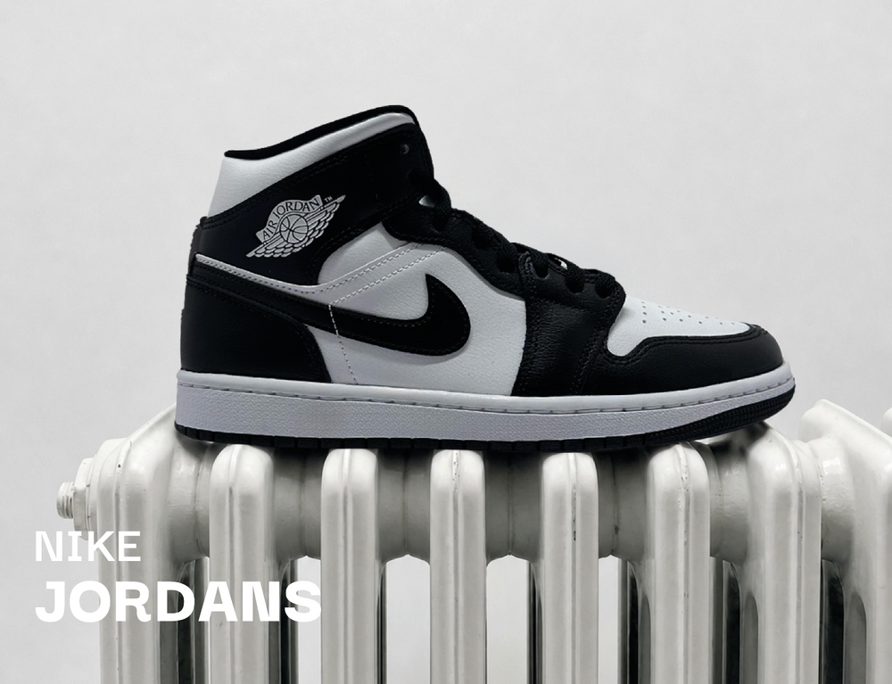 Nike Jordan Sneaker bei sneekrs in Schwarz und Weiß als moderner Streetwear-Banner