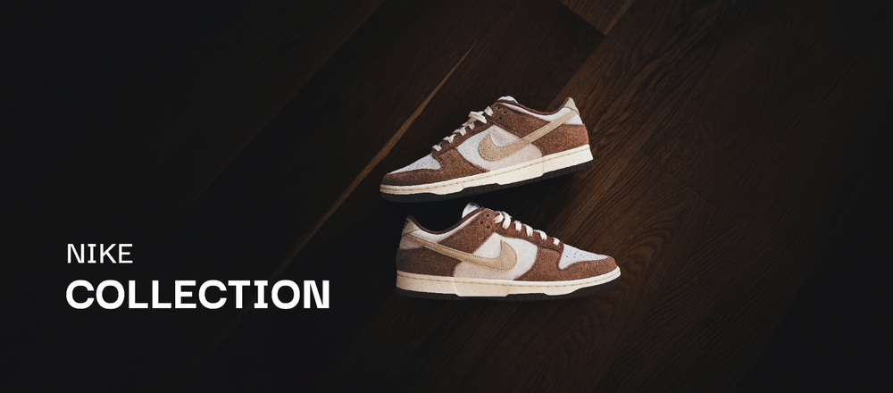 Braune Nike Sneaker auf dunklem Holzboden in der soleone Collection