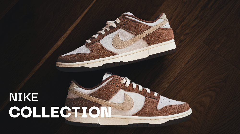 Braune Nike Sneaker auf dunklem Holzboden in der soleone Collection